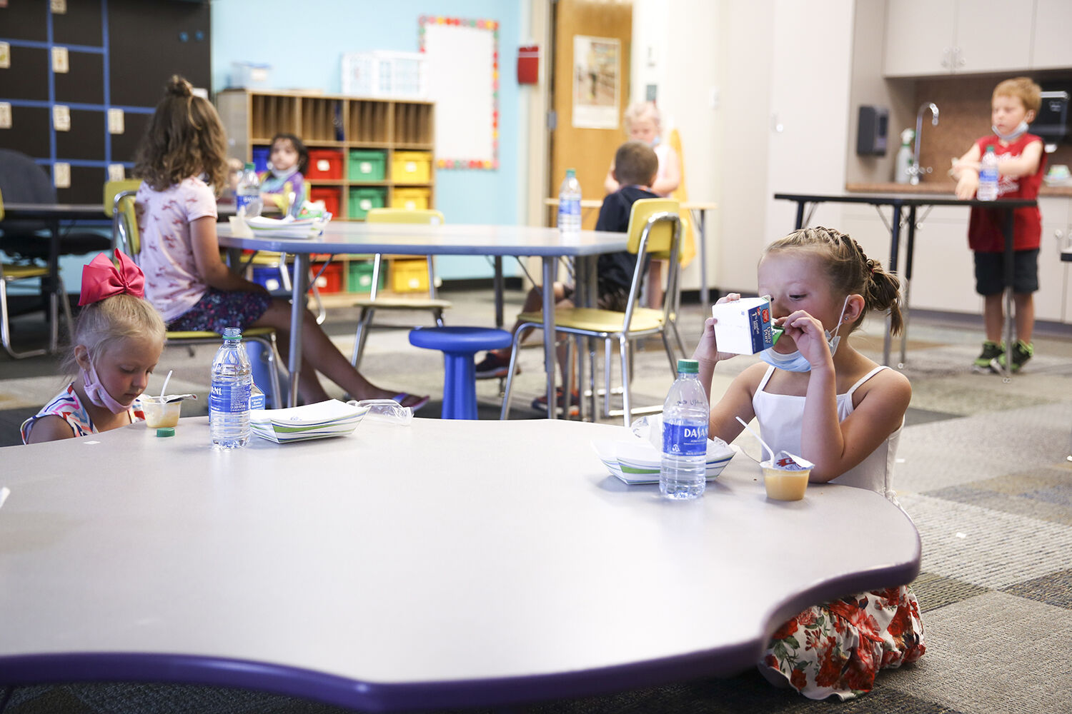 Lyvee Fox, 6, takes the second to last drink from her milk carton